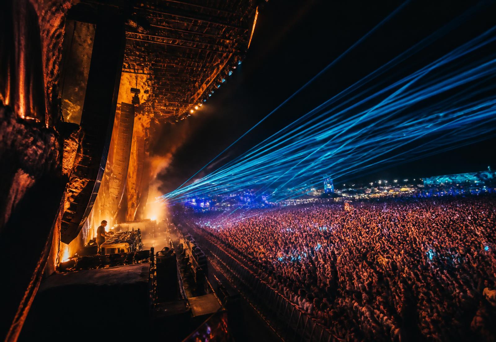 Festival stage lighting over a crowd